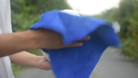 Close up hand Alcohol spray cleaning Football are New normal and Football League Stock Footage 130509366