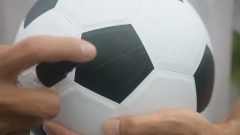Close up hand Alcohol spray cleaning Football are New normal and Football League Stock Footage 130509370