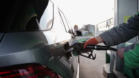 Close up of hand and fuel nozzle. Fuel nozzle getting out from diesel tank. Fuel Stock Footage 155056516
