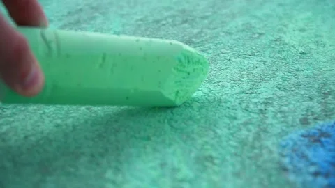 Close-up of a hand and piece of chalk for drawing Stock Footage 218174409