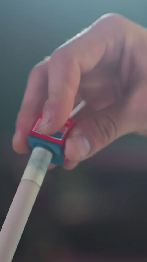 Close-Up Hand Applying Chalk to Cue Stick Before Billiards Game Stock Footage 319778429