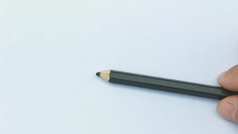 Close up hand of Artists,  Using black color pencil write Black on white paper.  Stock Footage 105553929