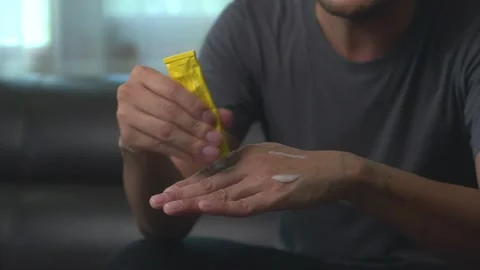 Close up hand of asian man applying  gel pain reliever. massages hand hurts.. Stock-Footage 246853626