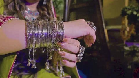 Close up of a hand of a beautiful Asian bride having bangles and rings. Stock Footage 243060464