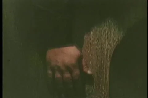 Close-up of hand blindly activating bomb hidden in manhole Stock Footage 11366085