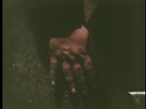 Close-up of hand blindly activating bomb hidden in manhole Stock Footage 260254701