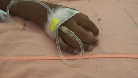 Close up hand boy in saline solution Stock Footage 108471764