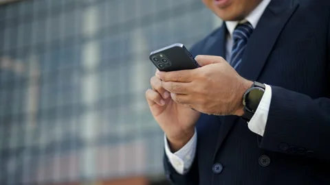 Close-up hand of businessman using smartphone application internet banking. Stock Footage 231753436