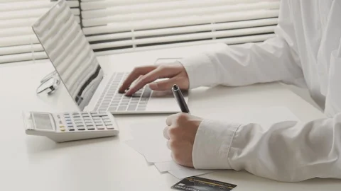 Close up hand of businessmen taking notes a pen are buying Stock Footage 113240486
