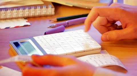 Close up of a hand with calculator Stock Footage 10760219