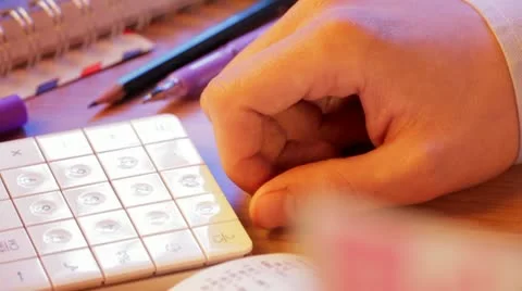 Close up of a hand with calculator Stock Footage 10760223