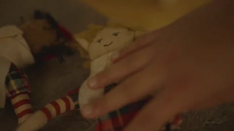 Close-up of hand catching doll Christmas decoration Stock Footage 334031394