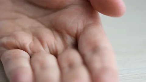 Close-up of hand changing pills or tablet for stack of US dollar bills Stock Footage 154679215
