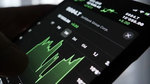 Close up hand checking stock market graphs on Smartphone. Stock Footage 149988845