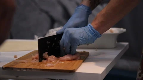 Close-up of hand chef cutting meat. Video stock 94960422