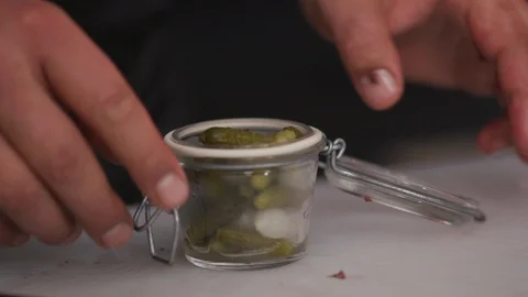 Close up hand chef takes pickles from the cans cucumbers ingredient organic Stock Footage 103290376