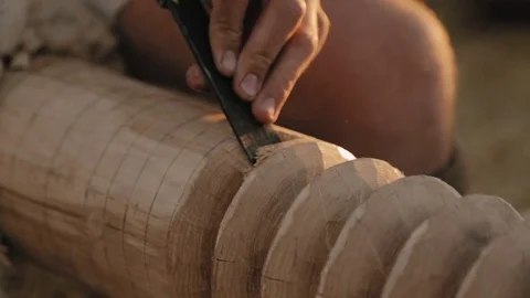 Close-up of the hand with chisel carving from the wood Stock Footage 79997725