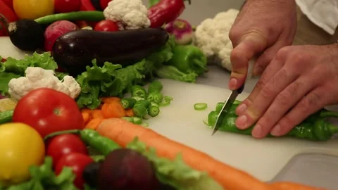Close Up Of Hand Chopping Fresh Green Pepper On Kitchen Table Stock Footage 343739913