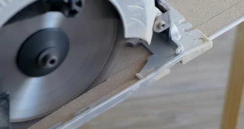 Close-up of Hand Circular Saw. Carpenter Sawing Detail For Wooden Furniture Stock Footage 134332683