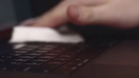 Close Up Hand Cleaning Black Computer Laptop, Disinfectant Wipes Stock Footage 143803242