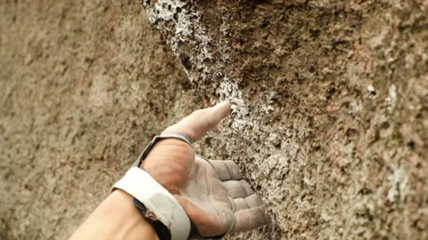 Close-up of the hand of a climber taking a rocky ledge. Stock-Footage 131368400