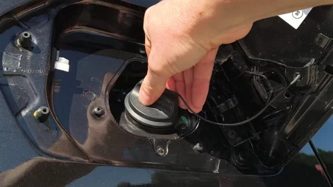 Close-up of hand closing car fuel cap 스톡 동영상 336570495