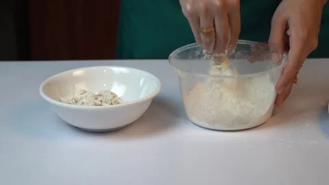Close up Hand Coating Fresh Shrimp with Seasoned Flour in Plastic Bowl 스톡 동영상 334322450