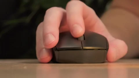Close-up of a hand on a computer mouse Stock Footage 264099477