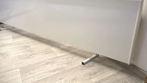 Close up of A hand Controlling The Temperature Of white electric convector 動画素材 87498817