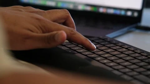 Close Up of a Hand copy paste on a Laptop Keyboard With a Colorful Blurred Stock Footage 344051101