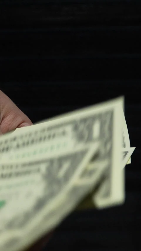 Close Up Of Hand Counting One Dollar Bills On Black Background Stock Footage 339971851