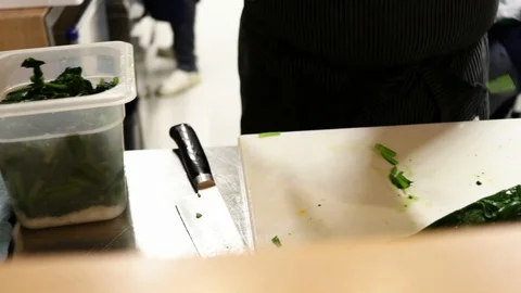Close up hand cutting chard, Ramen bar, Florence, Italy, HD Stock Footage 93100459