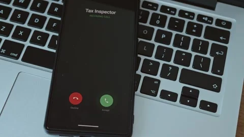 Close-up of a hand declining an incoming call from a Tax Inspector Stock Footage 337998866