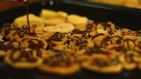 Close-up of hand decorating cookies. Stock Footage 49192028