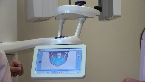 Close up hand of dentist sets panoramic digital X-ray Stock-Footage 99225771