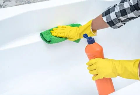 Close up hand with detergent cleaning bath. Cleaning service. croped hands we Stock Photos
