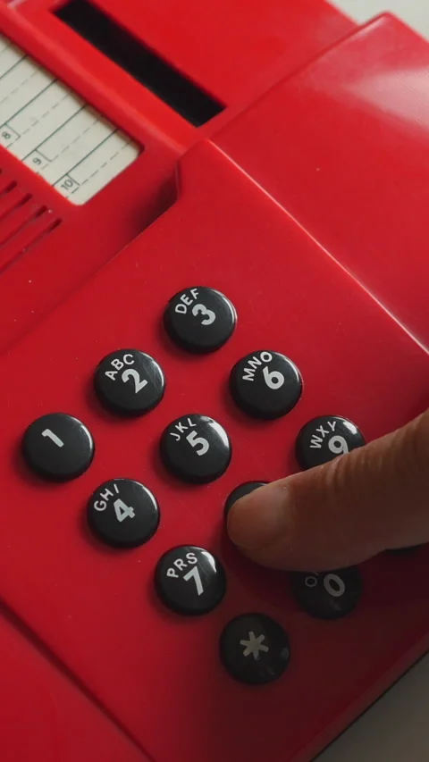 Close Up Of Hand Dialing Red Phone. Vertical. 스톡 동영상 303482109