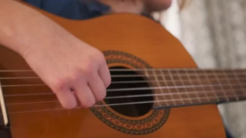 Close-up of hand doing fingerpicking exercise on classical guitar Video stock 314484088
