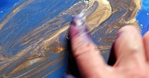 Close-up, hand drawing with blue paints. Creative process of creating. Fingers Stock Footage 229389730