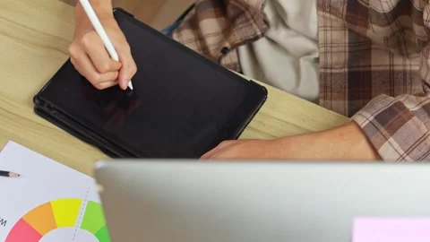 Close up of hand drawing creative sketch on digital graphics tablet for new Stock Footage 336737244