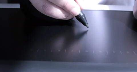 Close-up of hand drawing on a digital tablet with pencil Stock Footage 114951447