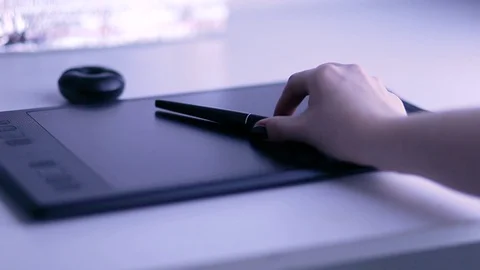 Close-up of hand drawing on a digital tablet with pencil. Stock Footage 119112381