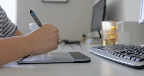 Close-up of hand drawing on a digital tablet with pencil. Professional retouch Video stock 127387802