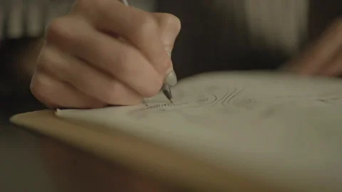 Close-up of hand drawing on notepad Stock Footage 334050090