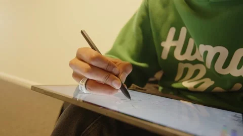 Close up hand drawing with pen on tablet computer Stock Footage 168991252