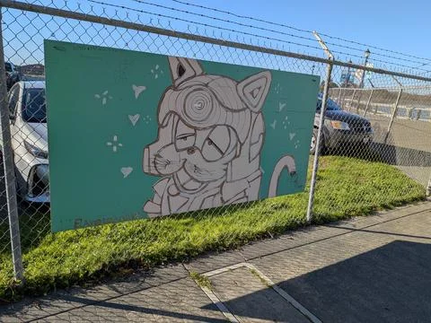 Close-up of hand-drawn artwork of a cat wearing a helmet with hearts Fotos de archivo