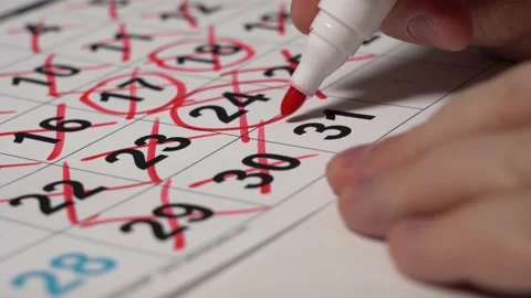 Close-up Hand Draws the Last Number of the Month in Red Marker 스톡 동영상 148096815