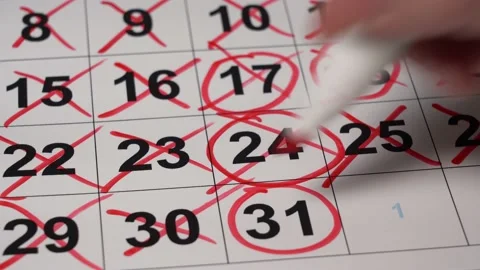 Close-up Hand Draws Red Marker Number on the Calendar. Stock Footage 167885907