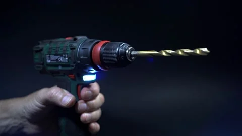Close up hand drill concept. black background. craftsmanship Stock Footage 219235770