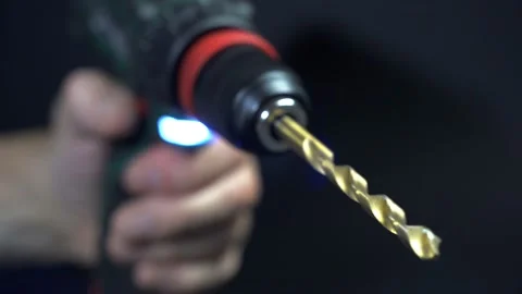 Close up hand drill concept. black background. craftsmanship Stock Footage 219235859
